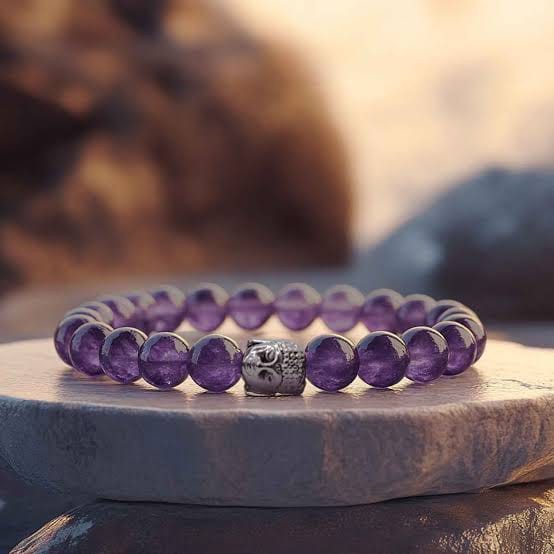 Amethyst bracelet with Buddha bead on a stone
