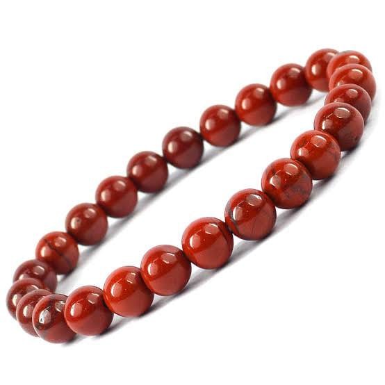 Natural Red Jasper bead bracelet on a white background