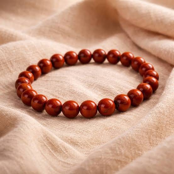 Natural Red Jasper bracelet with polished deep red beads on beige linen