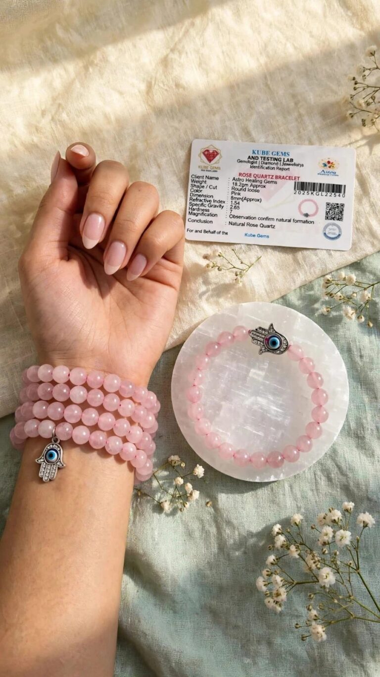 Natural Rose Quartz bracelets worn on the wrist with Hamsa charm and Kube Gems lab certificate