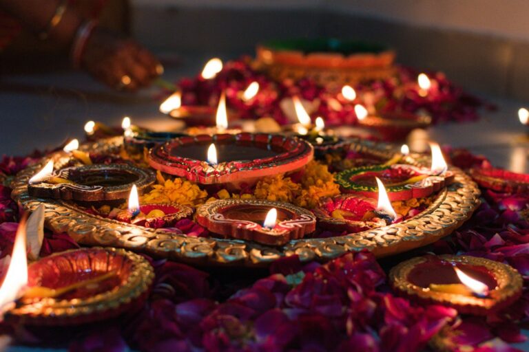 Lit clay diyas arranged for a Graha Shanti puja